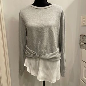 Gray sweatshirt with pleats at the bottom